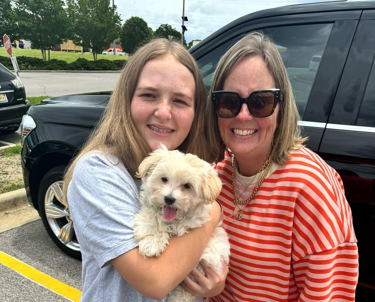 The Bennett Family with their Morkie Aura puppy